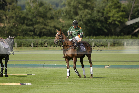 Maiz Dulce (green) v River (blue) in a Uber Polo Midsummer 12 goal polo match on Wednesday 21 August 2013 at Cowdray park Polo Club on Ambersham 2.  www.polopictures.co.uk