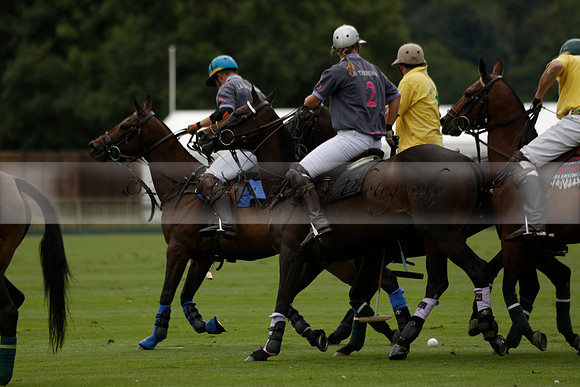La Tremenda (lilac) v Maiz Dulce (yellow) in a Brecknock Cup polo match played on Lawns 1 at the Cowdray Park Polo Club on Tuesday 13 August 2013