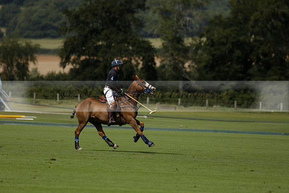 Maiz Dulce (green) v River (blue) in a Uber Polo Midsummer 12 goal polo match on Wednesday 21 August 2013 at Cowdray park Polo Club on Ambersham 2.  www.polopictures.co.uk