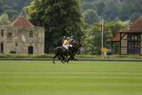 La Tremenda (lilac) v Maiz Dulce (yellow) in a Brecknock Cup polo match played on Lawns 1 at the Cowdray Park Polo Club on Tuesday 13 August 2013
