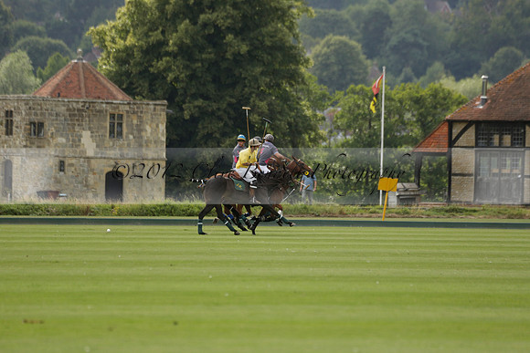 La Tremenda (lilac) v Maiz Dulce (yellow) in a Brecknock Cup polo match played on Lawns 1 at the Cowdray Park Polo Club on Tuesday 13 August 2013