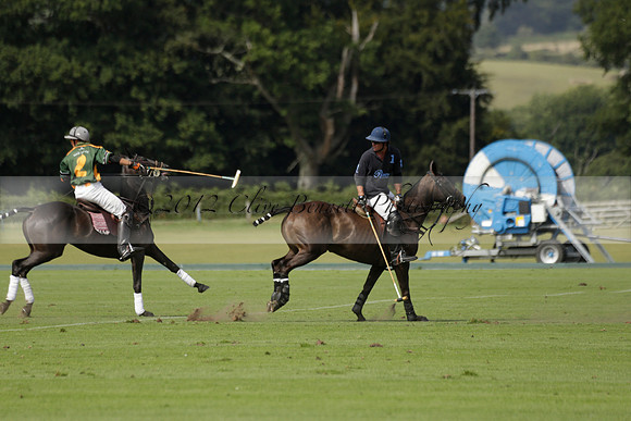 Maiz Dulce (green) v River (blue) in a Uber Polo Midsummer 12 goal polo match on Wednesday 21 August 2013 at Cowdray park Polo Club on Ambersham 2.  www.polopictures.co.uk