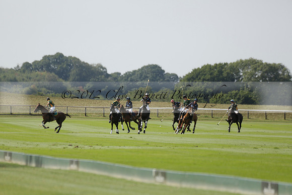 Maiz Dulce (green) v River (blue) in a Uber Polo Midsummer 12 goal polo match on Wednesday 21 August 2013 at Cowdray park Polo Club on Ambersham 2.  www.polopictures.co.uk