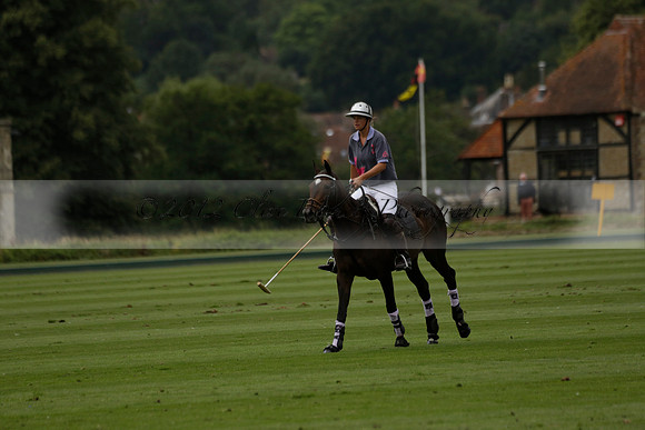 La Tremenda (lilac) v Maiz Dulce (yellow) in a Brecknock Cup polo match played on Lawns 1 at the Cowdray Park Polo Club on Tuesday 13 August 2013
