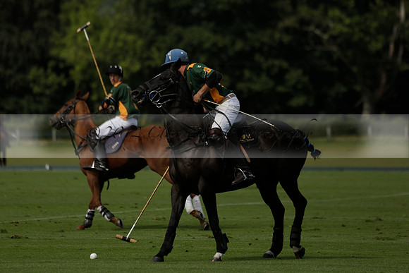 Maiz Dulce (green) v River (blue) in a Uber Polo Midsummer 12 goal polo match on Wednesday 21 August 2013 at Cowdray park Polo Club on Ambersham 2.  www.polopictures.co.uk