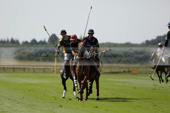 Maiz Dulce (green) v River (blue) in a Uber Polo Midsummer 12 goal polo match on Wednesday 21 August 2013 at Cowdray park Polo Club on Ambersham 2.  www.polopictures.co.uk