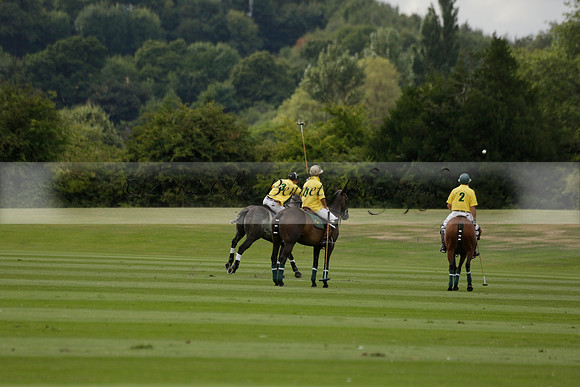 La Tremenda (lilac) v Maiz Dulce (yellow) in a Brecknock Cup polo match played on Lawns 1 at the Cowdray Park Polo Club on Tuesday 13 August 2013