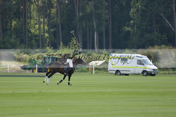 La Tremenda (mauve) v Maiz Dulce (green) in the Brecknock Cup  final polo match. Played at Cowdray Park Polo Club on Sunday 25 August 2013 on Ambersham 1. www.polopictures.co.uk