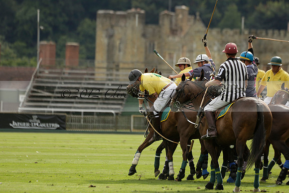 La Tremenda (lilac) v Maiz Dulce (yellow) in a Brecknock Cup polo match played on Lawns 1 at the Cowdray Park Polo Club on Tuesday 13 August 2013
