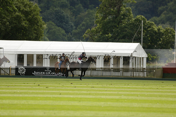 La Tremenda (lilac) v Maiz Dulce (yellow) in a Brecknock Cup polo match played on Lawns 1 at the Cowdray Park Polo Club on Tuesday 13 August 2013