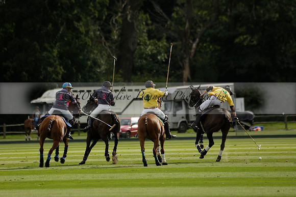 La Tremenda (lilac) v Maiz Dulce (yellow) in a Brecknock Cup polo match played on Lawns 1 at the Cowdray Park Polo Club on Tuesday 13 August 2013