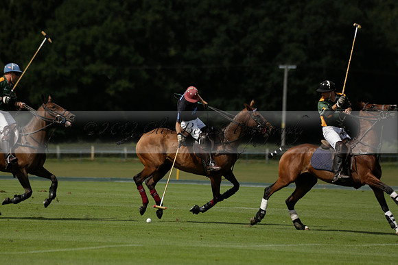 Maiz Dulce (green) v River (blue) in a Uber Polo Midsummer 12 goal polo match on Wednesday 21 August 2013 at Cowdray park Polo Club on Ambersham 2.  www.polopictures.co.uk