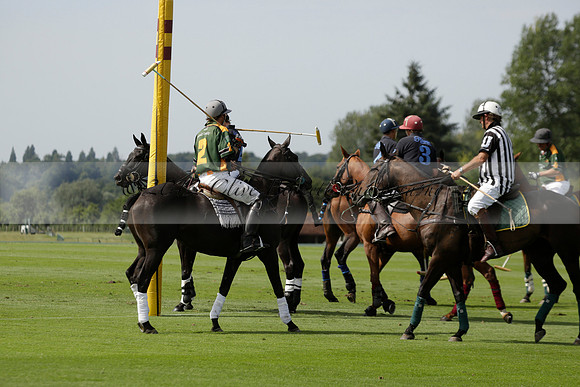 Maiz Dulce (green) v River (blue) in a Uber Polo Midsummer 12 goal polo match on Wednesday 21 August 2013 at Cowdray park Polo Club on Ambersham 2.  www.polopictures.co.uk
