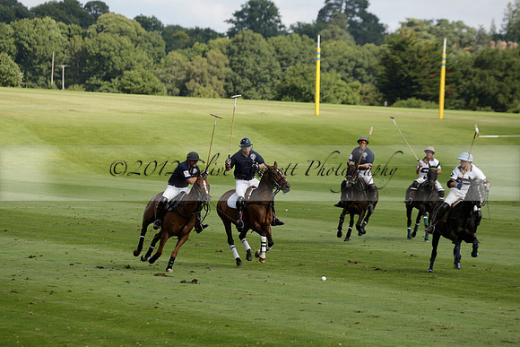Pandas (white) v Home Farm (navy) in a Park House West Sussex Cup Polo match on Brooksfield at Cowdray Park Polo Club on Friday 30 August 2013. 2013.08.30 www.polopictures.co.uk