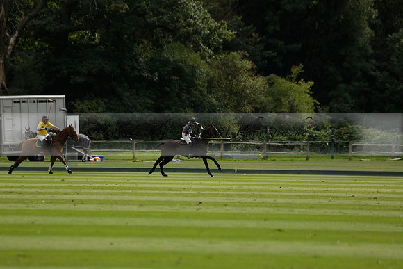 La Tremenda (lilac) v Maiz Dulce (yellow) in a Brecknock Cup polo match played on Lawns 1 at the Cowdray Park Polo Club on Tuesday 13 August 2013
