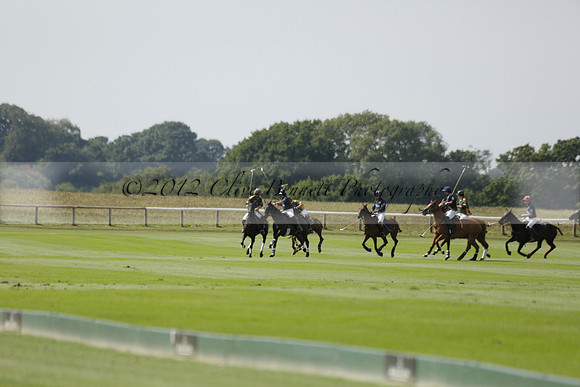 Maiz Dulce (green) v River (blue) in a Uber Polo Midsummer 12 goal polo match on Wednesday 21 August 2013 at Cowdray park Polo Club on Ambersham 2.  www.polopictures.co.uk