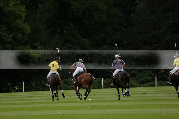 La Tremenda (lilac) v Maiz Dulce (yellow) in a Brecknock Cup polo match played on Lawns 1 at the Cowdray Park Polo Club on Tuesday 13 August 2013