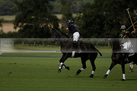 Maiz Dulce (green) v River (blue) in a Uber Polo Midsummer 12 goal polo match on Wednesday 21 August 2013 at Cowdray park Polo Club on Ambersham 2.  www.polopictures.co.uk