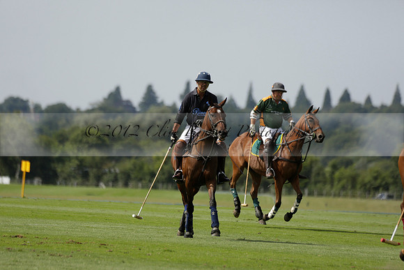 Maiz Dulce (green) v River (blue) in a Uber Polo Midsummer 12 goal polo match on Wednesday 21 August 2013 at Cowdray park Polo Club on Ambersham 2.  www.polopictures.co.uk