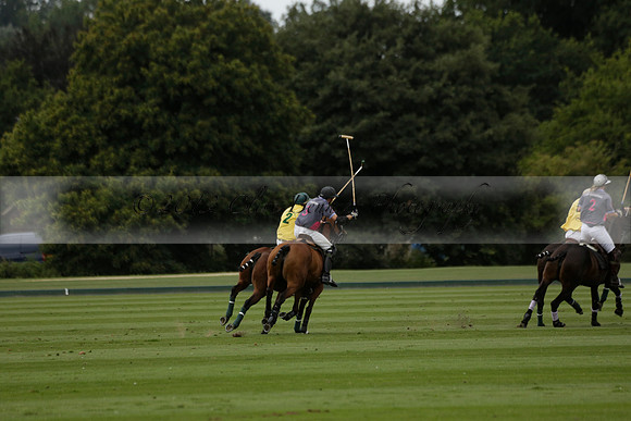 La Tremenda (lilac) v Maiz Dulce (yellow) in a Brecknock Cup polo match played on Lawns 1 at the Cowdray Park Polo Club on Tuesday 13 August 2013