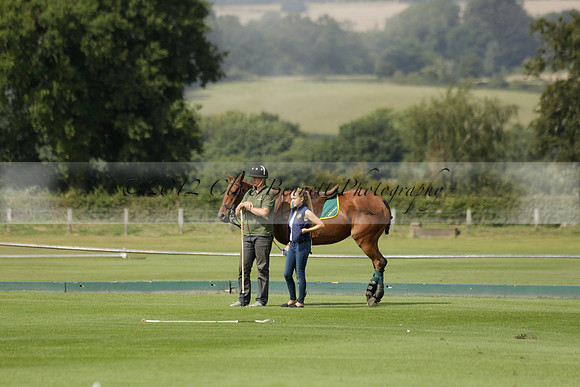 Maiz Dulce (green) v River (blue) in a Uber Polo Midsummer 12 goal polo match on Wednesday 21 August 2013 at Cowdray park Polo Club on Ambersham 2.  www.polopictures.co.uk