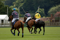 La Tremenda (lilac) v Maiz Dulce (yellow) in a Brecknock Cup polo match played on Lawns 1 at the Cowdray Park Polo Club on Tuesday 13 August 2013