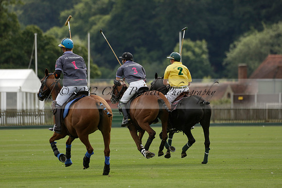 La Tremenda (lilac) v Maiz Dulce (yellow) in a Brecknock Cup polo match played on Lawns 1 at the Cowdray Park Polo Club on Tuesday 13 August 2013