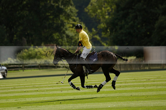 La Tremenda (lilac) v Maiz Dulce (yellow) in a Brecknock Cup polo match played on Lawns 1 at the Cowdray Park Polo Club on Tuesday 13 August 2013