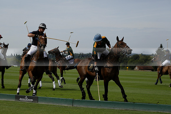 Maiz Dulce (green) v River (blue) in a Uber Polo Midsummer 12 goal polo match on Wednesday 21 August 2013 at Cowdray park Polo Club on Ambersham 2.  www.polopictures.co.uk
