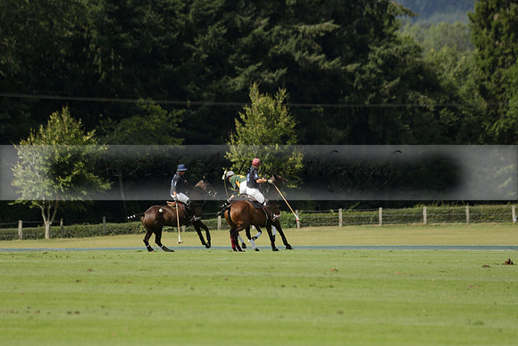 Maiz Dulce (green) v River (blue) in a Uber Polo Midsummer 12 goal polo match on Wednesday 21 August 2013 at Cowdray park Polo Club on Ambersham 2.  www.polopictures.co.uk