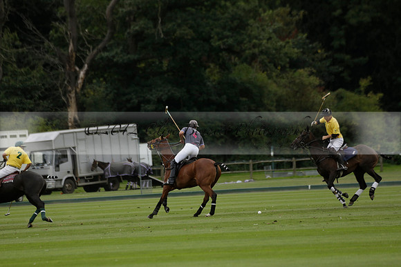 La Tremenda (lilac) v Maiz Dulce (yellow) in a Brecknock Cup polo match played on Lawns 1 at the Cowdray Park Polo Club on Tuesday 13 August 2013