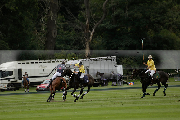 La Tremenda (lilac) v Maiz Dulce (yellow) in a Brecknock Cup polo match played on Lawns 1 at the Cowdray Park Polo Club on Tuesday 13 August 2013