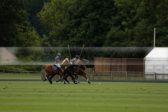 La Tremenda (lilac) v Maiz Dulce (yellow) in a Brecknock Cup polo match played on Lawns 1 at the Cowdray Park Polo Club on Tuesday 13 August 2013