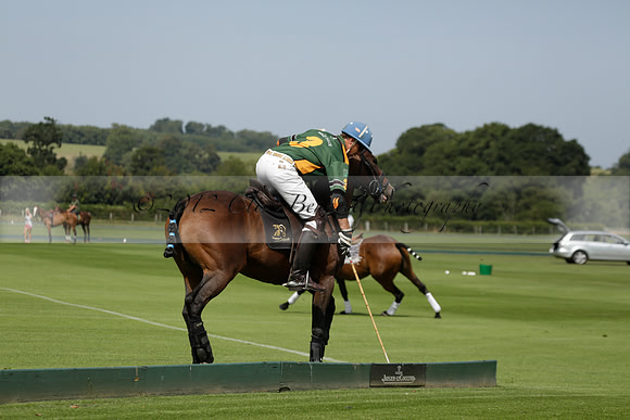 Maiz Dulce (green) v River (blue) in a Uber Polo Midsummer 12 goal polo match on Wednesday 21 August 2013 at Cowdray park Polo Club on Ambersham 2.  www.polopictures.co.uk