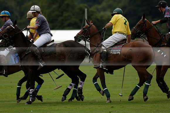 La Tremenda (lilac) v Maiz Dulce (yellow) in a Brecknock Cup polo match played on Lawns 1 at the Cowdray Park Polo Club on Tuesday 13 August 2013