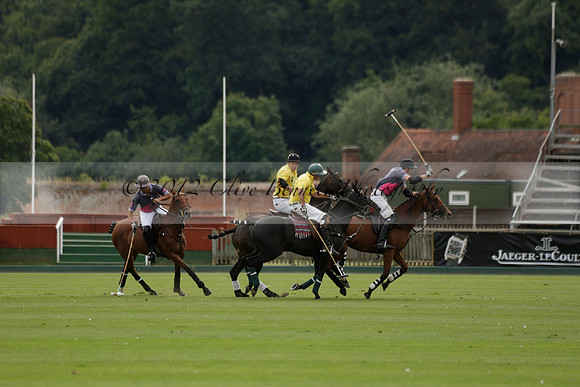 La Tremenda (lilac) v Maiz Dulce (yellow) in a Brecknock Cup polo match played on Lawns 1 at the Cowdray Park Polo Club on Tuesday 13 August 2013