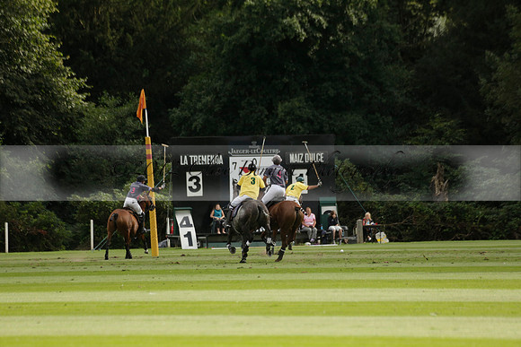 La Tremenda (lilac) v Maiz Dulce (yellow) in a Brecknock Cup polo match played on Lawns 1 at the Cowdray Park Polo Club on Tuesday 13 August 2013