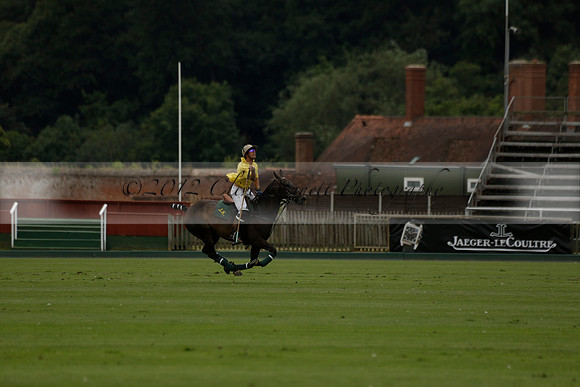 La Tremenda (lilac) v Maiz Dulce (yellow) in a Brecknock Cup polo match played on Lawns 1 at the Cowdray Park Polo Club on Tuesday 13 August 2013
