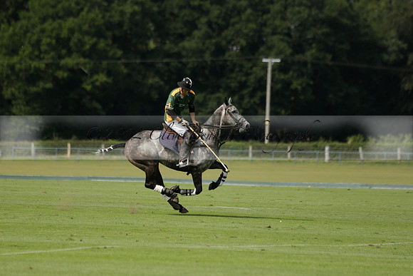 Maiz Dulce (green) v River (blue) in a Uber Polo Midsummer 12 goal polo match on Wednesday 21 August 2013 at Cowdray park Polo Club on Ambersham 2.  www.polopictures.co.uk