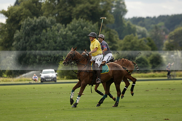 La Tremenda (lilac) v Maiz Dulce (yellow) in a Brecknock Cup polo match played on Lawns 1 at the Cowdray Park Polo Club on Tuesday 13 August 2013