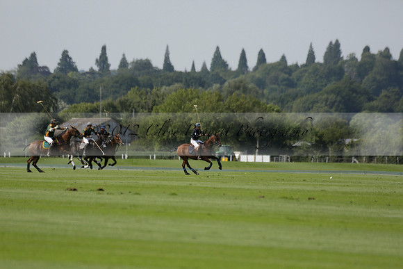 Maiz Dulce (green) v River (blue) in a Uber Polo Midsummer 12 goal polo match on Wednesday 21 August 2013 at Cowdray park Polo Club on Ambersham 2.  www.polopictures.co.uk