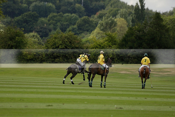 La Tremenda (lilac) v Maiz Dulce (yellow) in a Brecknock Cup polo match played on Lawns 1 at the Cowdray Park Polo Club on Tuesday 13 August 2013