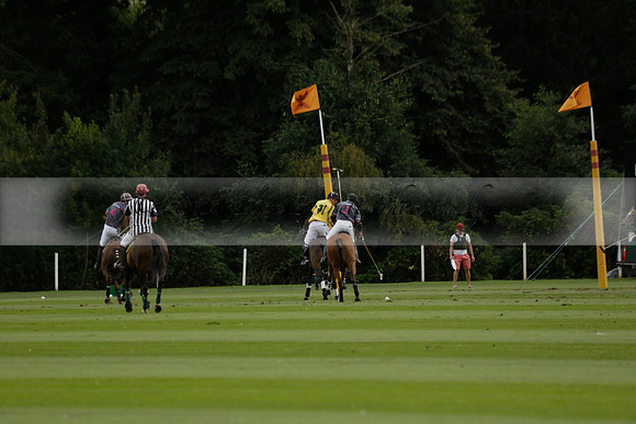 La Tremenda (lilac) v Maiz Dulce (yellow) in a Brecknock Cup polo match played on Lawns 1 at the Cowdray Park Polo Club on Tuesday 13 August 2013