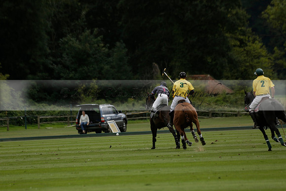 La Tremenda (lilac) v Maiz Dulce (yellow) in a Brecknock Cup polo match played on Lawns 1 at the Cowdray Park Polo Club on Tuesday 13 August 2013