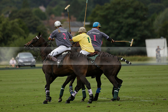 La Tremenda (lilac) v Maiz Dulce (yellow) in a Brecknock Cup polo match played on Lawns 1 at the Cowdray Park Polo Club on Tuesday 13 August 2013