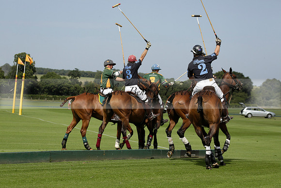 Maiz Dulce (green) v River (blue) in a Uber Polo Midsummer 12 goal polo match on Wednesday 21 August 2013 at Cowdray park Polo Club on Ambersham 2.  www.polopictures.co.uk