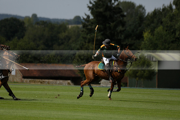 Maiz Dulce (green) v River (blue) in a Uber Polo Midsummer 12 goal polo match on Wednesday 21 August 2013 at Cowdray park Polo Club on Ambersham 2.  www.polopictures.co.uk