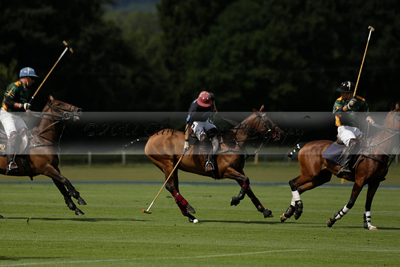 Maiz Dulce (green) v River (blue) in a Uber Polo Midsummer 12 goal polo match on Wednesday 21 August 2013 at Cowdray park Polo Club on Ambersham 2.  www.polopictures.co.uk