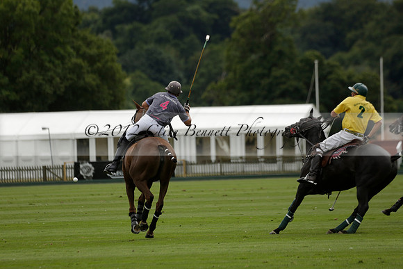 La Tremenda (lilac) v Maiz Dulce (yellow) in a Brecknock Cup polo match played on Lawns 1 at the Cowdray Park Polo Club on Tuesday 13 August 2013