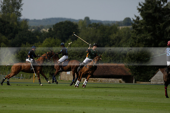 Maiz Dulce (green) v River (blue) in a Uber Polo Midsummer 12 goal polo match on Wednesday 21 August 2013 at Cowdray park Polo Club on Ambersham 2.  www.polopictures.co.uk